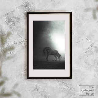 Dramatic fine art photography print of a horse galloping through darkness by Anna Archinger - framed print mockup