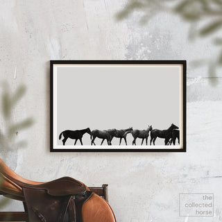 Minimalist equestrian photography art print of Thoroughbred racehorses in Saratoga by Kate Stephenson - framed wall art mockup with saddle