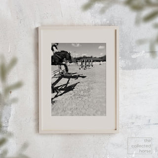Black and white equine photography art print of a horse jumping over an oxer by Morgan German - framed wall art print mockup