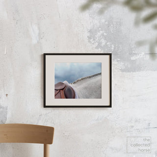 A grey hunter horse with a braided mane against a blue sky by Morgan German - matted giclée wall art print mockup