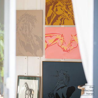 photo of original horse art paintings hanging inside the studio of california artist sara ceraldi.